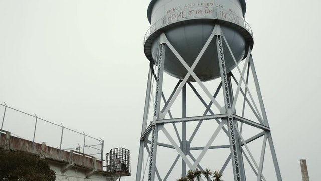 Tilt up shot of from ground to water reservoir on Alcatraz island, USA