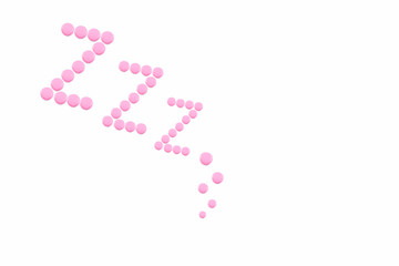 Pink pills in Z shape on the white background. Sleeping pills, hypnotic drugs, sedative. Insomnia. Psychology.