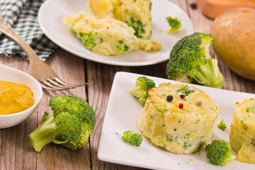 Potato gratins with broccoli florets.