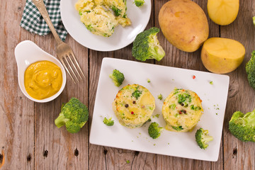 Potato gratins with broccoli florets.