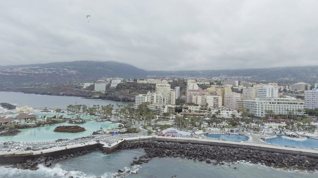 Puerto de la Cruz in Tenerife. Aerial view of city skyline and famous pools