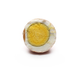 Boiled egg sliced in half isolated on white background