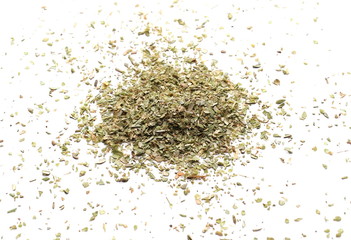 Pile of dried oregano leaves isolated on white background