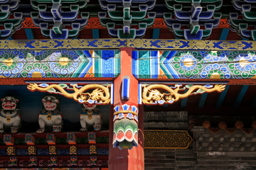 Fototapeta premium Doorcase decoration coloured drawing or pattern in a temple