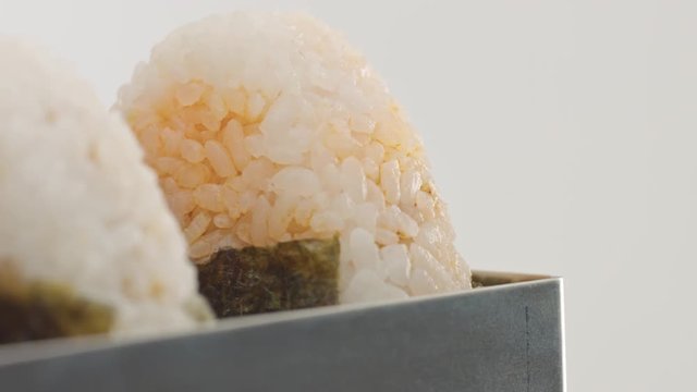 macro panned vide three onigiri rice ball