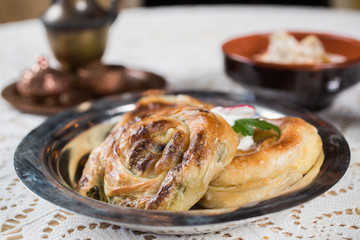 Homemade cheese and spinach pie on a  plate
