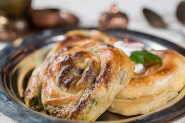 Homemade cheese and spinach pie on a  plate