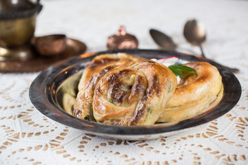 Homemade cheese and spinach pie on a  plate