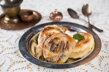 Homemade cheese and spinach pie on a  plate