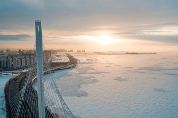 Bridge over the Neva River in winter sunset