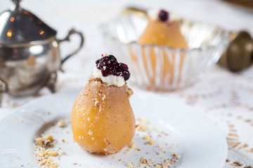 baked pear with walnuts, hazelnuts and cream
