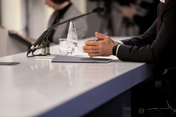 Journalist is taking notes during a conference