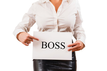 Fototapeta na wymiar Business woman in the blouse holding white paper with written word boss. Office style. Concept