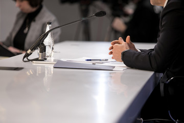 close up of conference meeting microphones