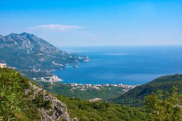 Fototapeta na wymiar Top view of town of Budva with high mountains and sea, Montenegro