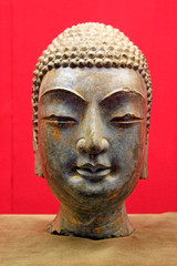 Fototapeta na wymiar Stone carvings head portrait of the Buddha in a museum, China