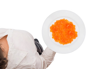 Top view of a waitress in a white blouse carrying plate with red salmon caviar on the white background. Concept. Isolated