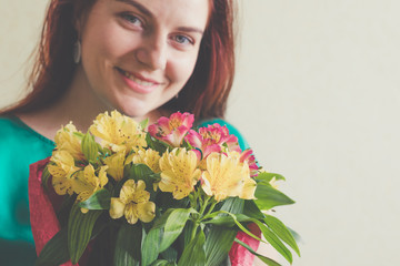 Image of cute woman with bouquet. 8 march