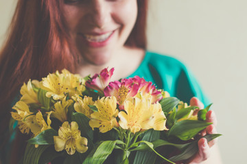 Image of cute woman with bouquet. 8 march
