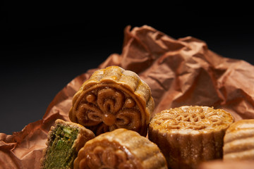 close up of traditional chinese mooncakes isolated on black