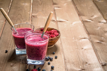 Berry smoothie in glasses .