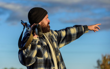 Man brutal unshaved gamekeeper nature background. Hunting permit. Hunting brutal masculine hobby....