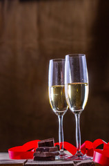 champagne glasses on gold background. Valentines day
