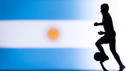 Fototapeta na wymiar Argentina National Flag. Football, Soccer player Silhouette