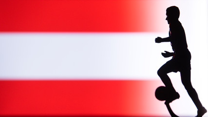 Fototapeta na wymiar Austria National Flag. Football, Soccer player Silhouette