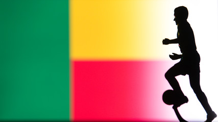 Fototapeta na wymiar Benin National Flag. Football, Soccer player Silhouette