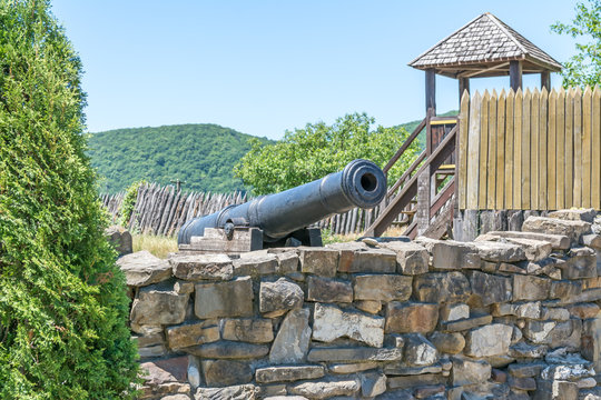 Old gun on the carriage on the fortress wall