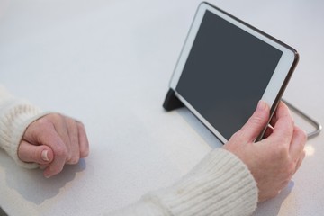 Woman with digital tablet at home