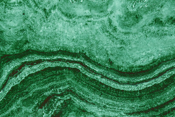 the texture of artificial marble green emerald color with a beautiful pattern similar to the mineral malachite.