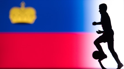 Fototapeta na wymiar Liechtenstein National Flag. Football, Soccer player Silhouette
