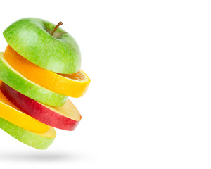 Fresh fruits. Stack of apple and orange slices on white
