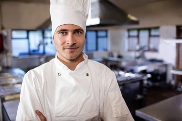 Male chef standing in kitchen at hotel