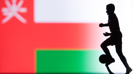 Fototapeta na wymiar Oman National Flag. Football, Soccer player Silhouette