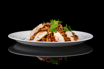 noodles with meat on a black background