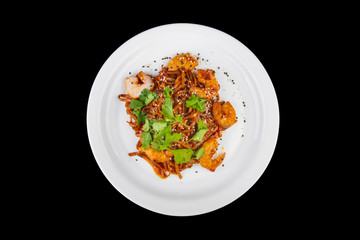 noodles with meat on a black background