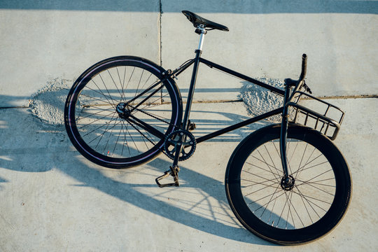 Customized commuter fixie bike at concrete wall