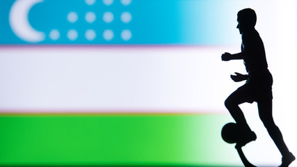 Fototapeta na wymiar Uzbekistan National Flag. Football, Soccer player Silhouette