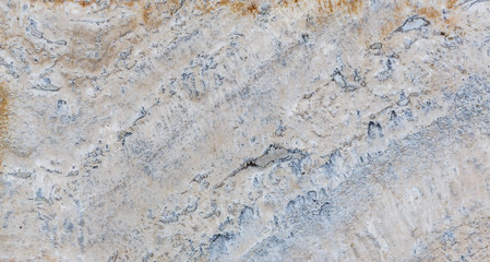the texture of artificial marble is light natural beige with a beautiful pattern and dark inclusions.