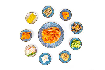 Kimchi with supplements on a white background