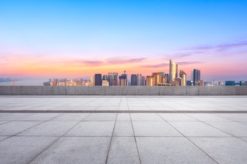 Empty floor and city skyline at sunrise in hangzhou,high angle view