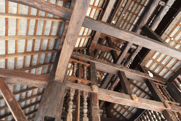 Closeup on technology detail of wood structure skeleton construction of classic old traditional Thai house.