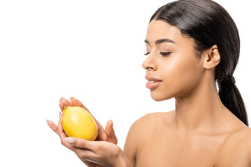 Obraz na płótnie Canvas beautiful naked african american girl holding fresh lemon isolated on white