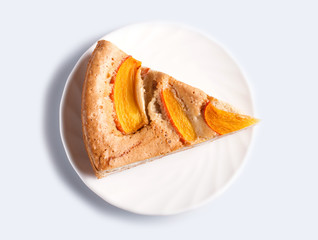 A slice of  sweet persimmon pie isolated on white background