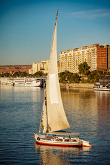 River Nile tourist boat Felucca at sunset in Luxor Thebes