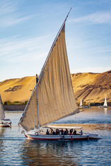 Tourists in a Felucca boat on the Nile River in Luxor Thebes