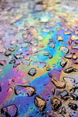 Rainbow Liquid Petrol Pollution Leak on Asphult Road